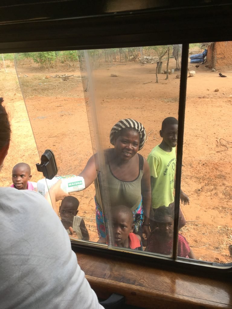 African Safari: handing over some flour to the poor