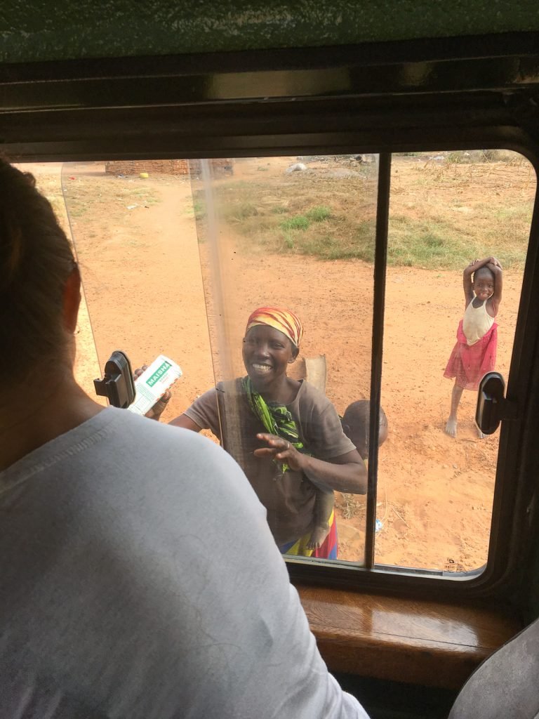 African Safari: handing over some flour to the poor