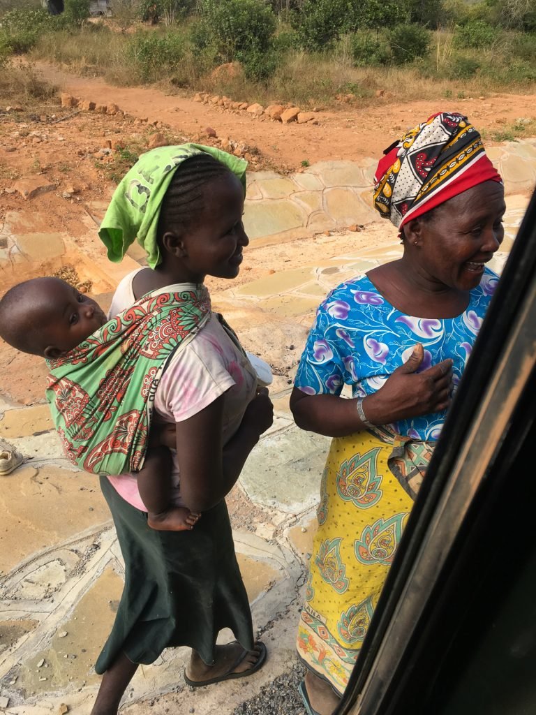 African Safari: handing over some flour to the poor